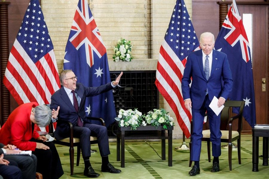 US President Joe Biden jokingly pretends to walk away as Australia's Prime Minister Anthony Albanese speaks at a bilateral meeting alongside the Quad Summit at Kantei Palace in Tokyo, Japan, 24 May 2022. (Jonathan Ernst/Reuters)
