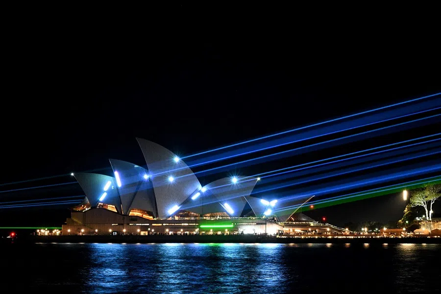 Laser beams illuminate the sails of Opera House Sydney on 20 October 2023, during celebrations to mark its 50th anniversary. (Saeed Khan/AFP)