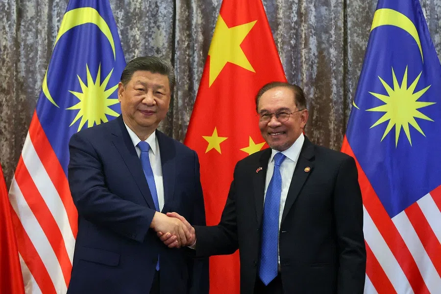 China’s President Xi Jinping and Malaysia’s Prime Minister Anwar Ibrahim shake hands after attending an agreement exchange session at the official residence of the prime minister in Putrajaya, outside Kuala Lumpur, on 16 April 2025. (Fazry Ismail/AFP)