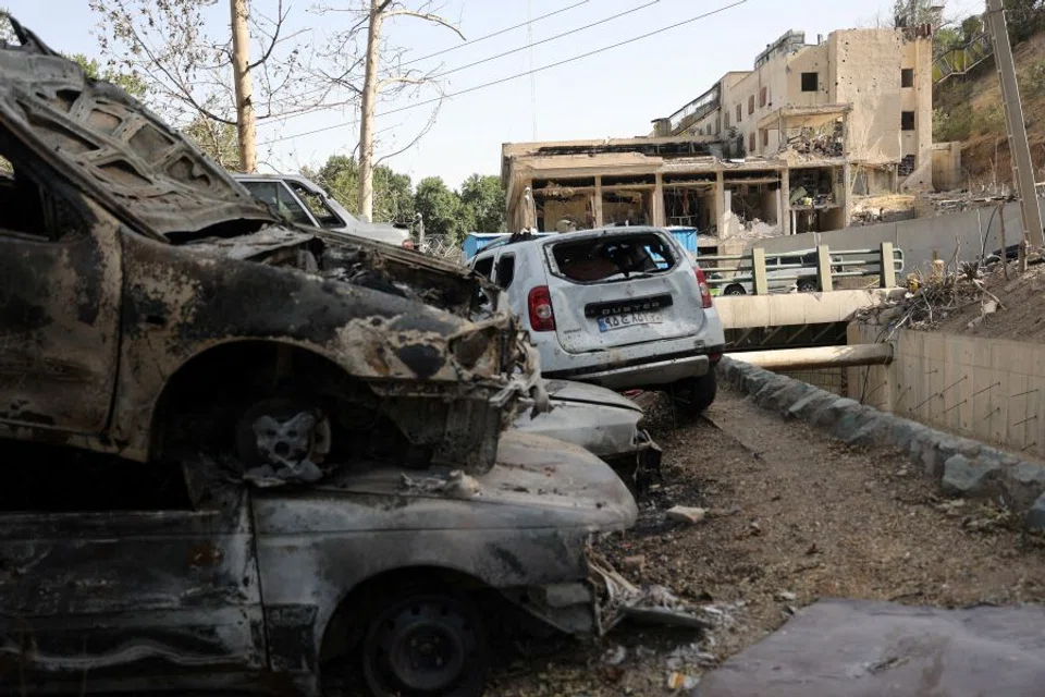 Vehicles are damaged as a view shows the aftermath of an Israeli strike on Evin Prison that took place on 23 June, after the ceasefire between Israel and Iran, in Tehran, Iran, on 29 June 2025.  (Majid Asgaripour/WANA (West Asia News Agency) via Reuters)