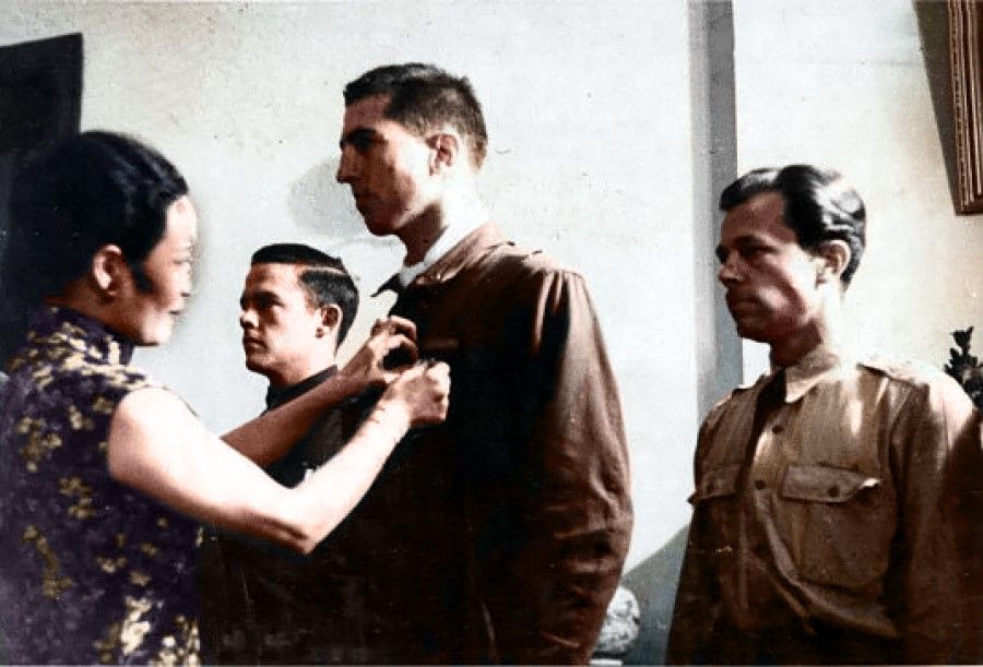 Madame Chiang pinning a medal on a pilot in the Doolittle Raid.