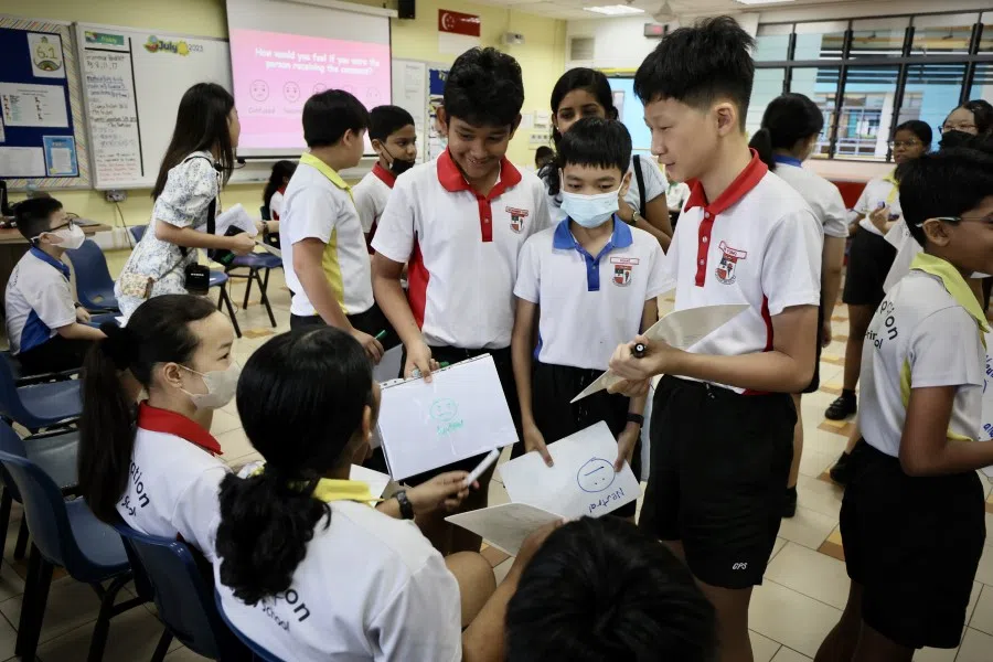 Young school children interact in a classroom activity. Class names in schools trace the evolution of society. (SPH Media)