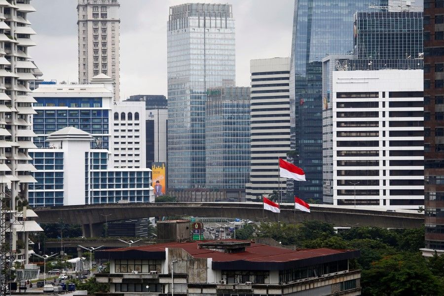 Indonesian national flags fly at a business district, following the coronavirus disease (COVID-19) outbreak, in Jakarta, Indonesia, 5 February 2021. (Ajeng Dinar Ulfiana/REUTERS)