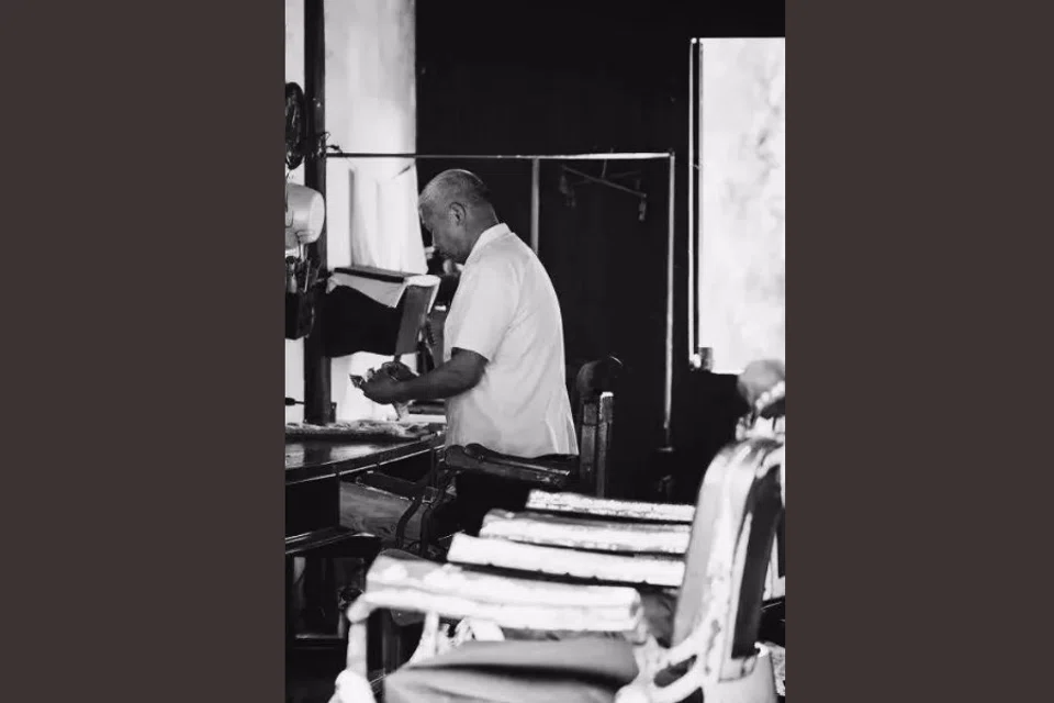 A barber in a barbershop.