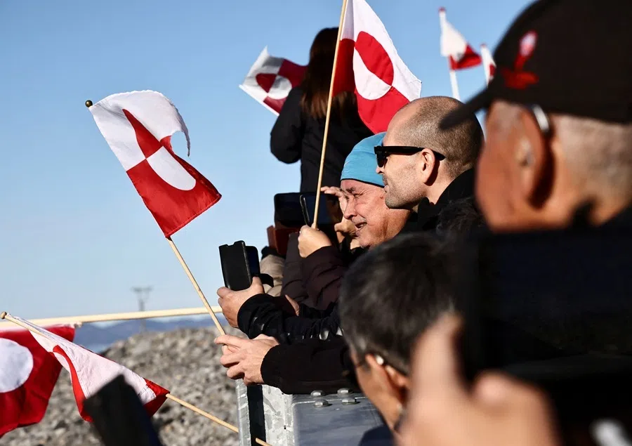 People wait for the arrival of the Greenlandic delegation after they agreed on a security deal with the US and Denmark at Nuuk Airport in Nuuk, Greenland, 23 September 2026.