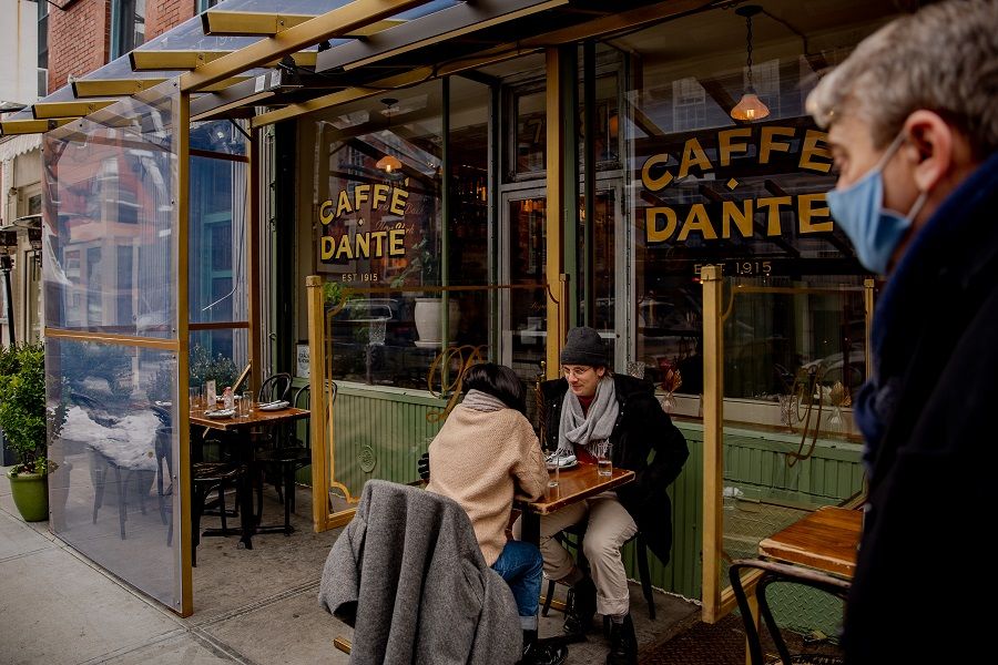 People eat outdoors at Caffé Dante in the Greenwich Village neighborhood of New York, US, on 12 February 2021. (Amir Hamja/Bloomberg)