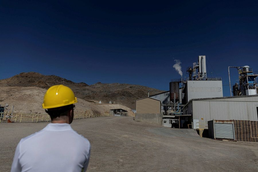 An employee stands outside an Albemarle Lithium production facility in Silver Peak, Nevada, US, 6 October 2022. (Carlos Barria/File Photo/Reuters)
