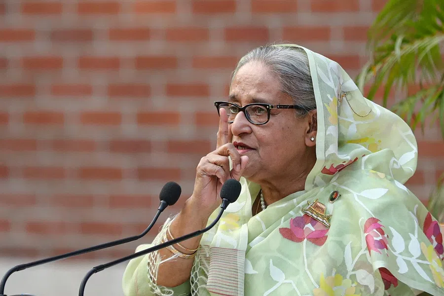 Sheikh Hasina, the newly elected prime minister of Bangladesh and chairperson of the Bangladesh Awami League, gestures during a meeting with foreign observers and journalists at the Prime Minister's residence in Dhaka, Bangladesh, on 8 January 2024. (Mohammad Ponir Hossain/Reuters)