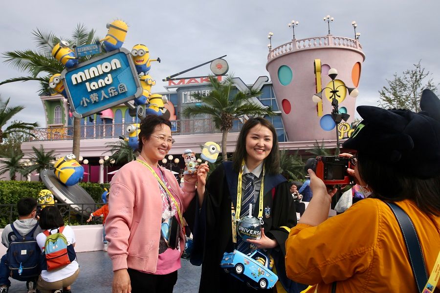 People pose for photos outside Minion Land at Universal Studios Beijing, China, 20 September 2021. (CNS)