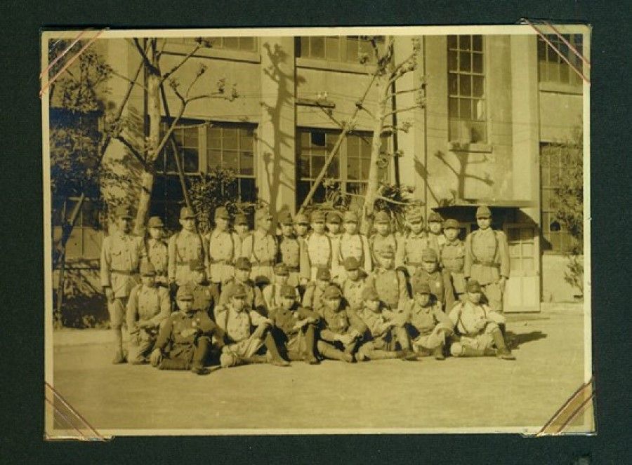 The album owner (rightmost, standing) when he was attending military training during his university days.