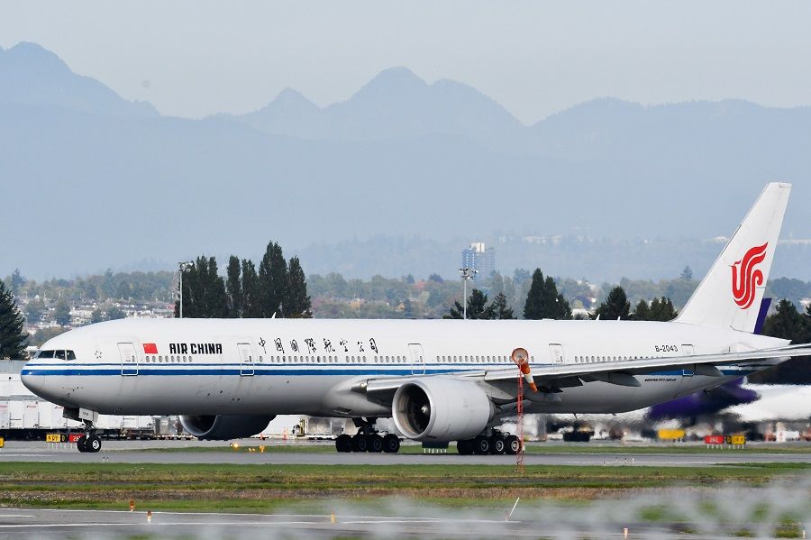 An Air China flight bound for Shenzhen, believed to be carrying Huawei CFO Meng Wanzhou, takes off from Vancouver International Aiport in Richmond, British Columbia, Canada, 24 September 2021. (Jennifer Gauthier/Reuters)
