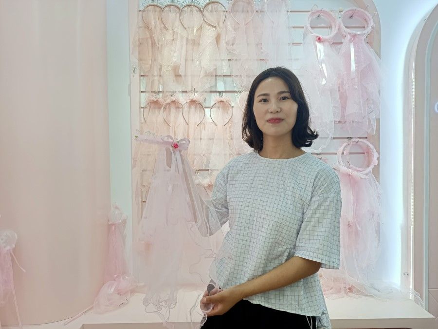 Designer Liu Yuanli shows off her creations.