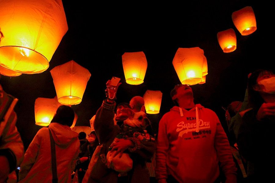 People in Taiwan celebrate the Lantern Festival in New Taipei City, Taiwan, 5 February 2023. (Ann Wang/Reuters)