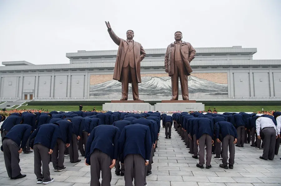 People pay tribute to the statues of late North Korean leaders Kim Il Sung and Kim Jong Il to pay their respects on the occasion of the 81st founding anniversary of the Workers' Party of Korea at Mansu Hill in Pyongyang on 10 October 2026.