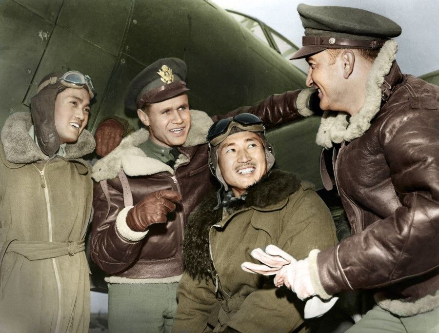 Chinese and American air force pilots talk, after a mission against the Japanese, March 1943. Both sides forged a deep friendship from fighting against the Japanese.