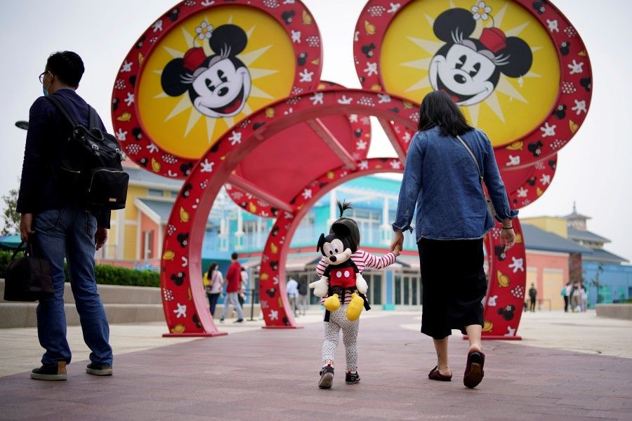 Visitors are seen at Shanghai Disney Resort a day before the Shanghai Disneyland theme park reopens following a shutdown due to the coronavirus disease (COVID-19) outbreak, in Shanghai, China, 10 May 2020. (Aly Song/Reuters)