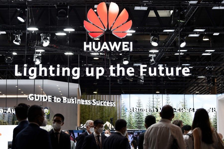 People visit the Huawei stand at the Mobile World Congress (MWC) fair in Barcelona on 29 June 2021. (Josep Lago/AFP)