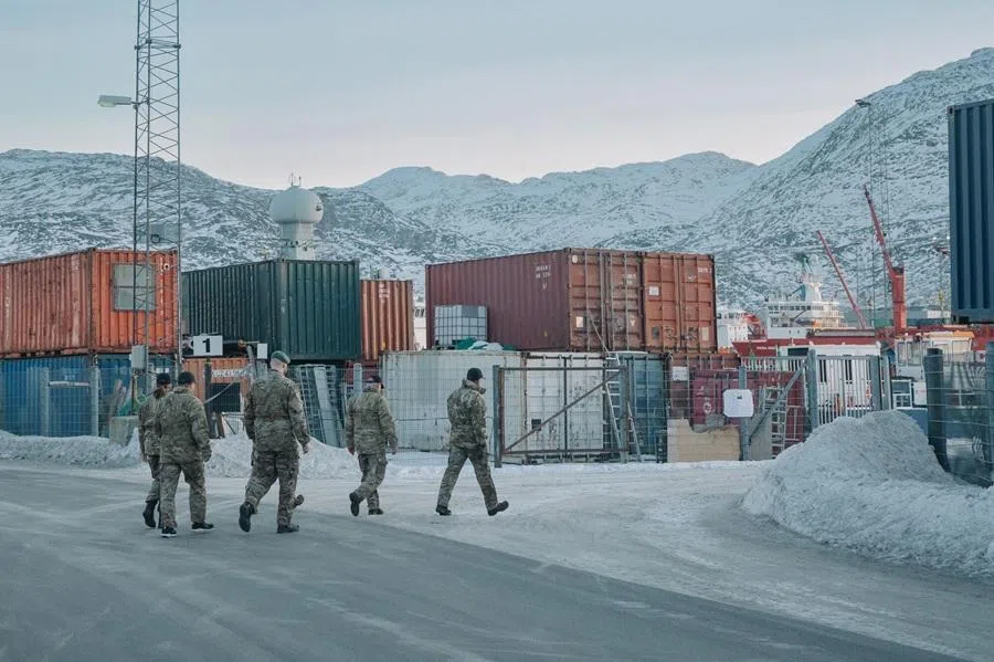 A group of Danish soldiers near shipping containers in the harbour in Nuuk, Greenland, on 29 January 2026. (Juliette Pavy/Bloomberg)