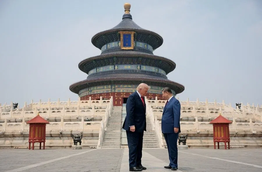 US President Donald Trump and Chinese President Xi Jinping stand together as they tour the Temple of Heaven in Beijing, China, on 14 May 2026.