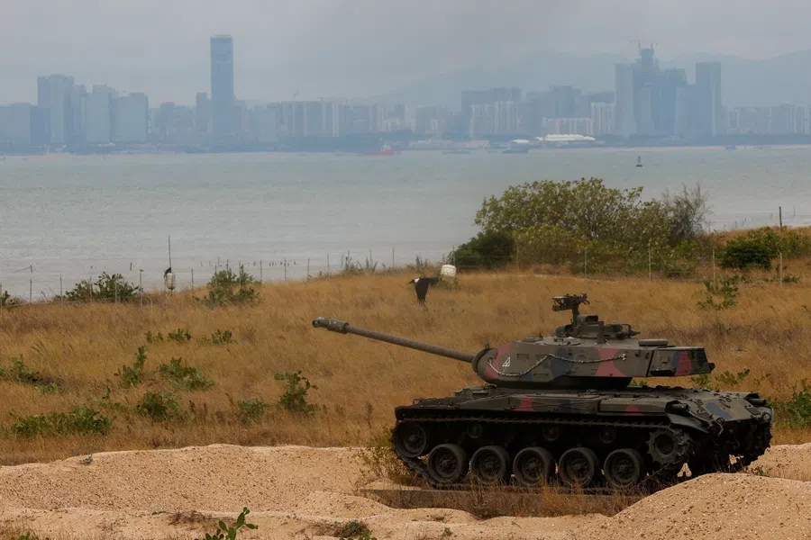 A retired military tank is seen on the beach with China in the background in Kinmen, Taiwan, on 20 December 2023. (Ann Wang/Reuters)