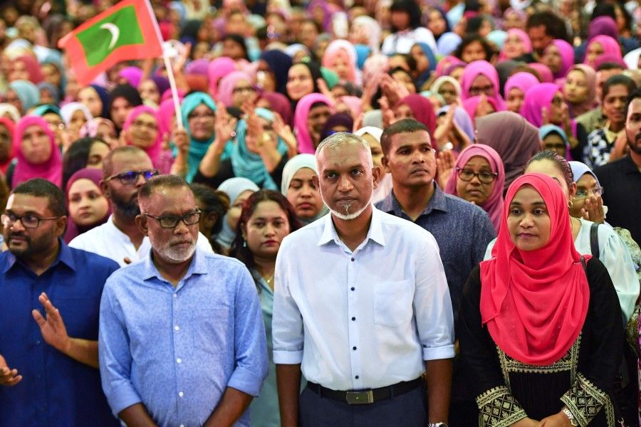 Maldives' President-elect Mohamed Muizzu (centre) of the People's National Congress (PNC) party delivers a speech during a gathering with supporters following the country's presidential election, in Male on 2 October 2023. (Mohamed Afrah/AFP)