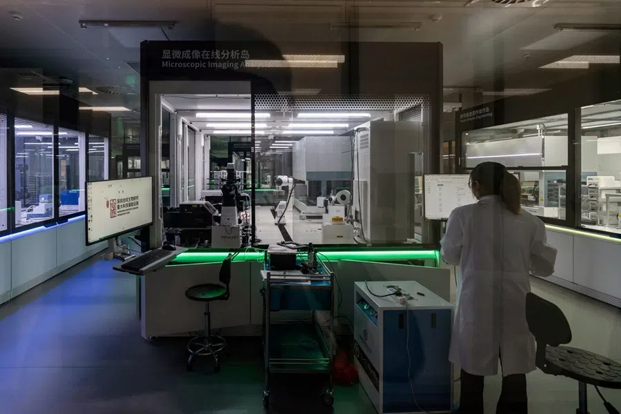 A researcher inside a lab at the Shenzhen Synthetic Biology Infrastructure facility in Shenzhen, China, on 26 November 2025. (Qilai Shen/Bloomberg)