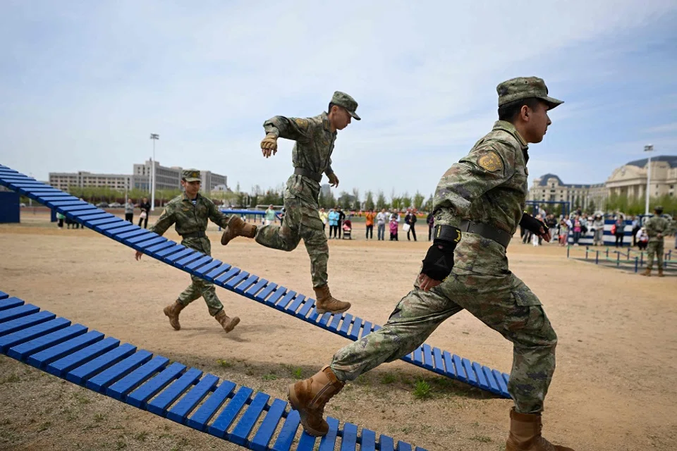 This picture taken during a media tour shows navy personnel demonstrating their training at the People’s Liberation Army Navy Submarine Academy during an open day to mark the navy’s 75th anniversary in Qingdao, China’s Shandong province on 21 April 2024. (Wang Zhao/AFP)