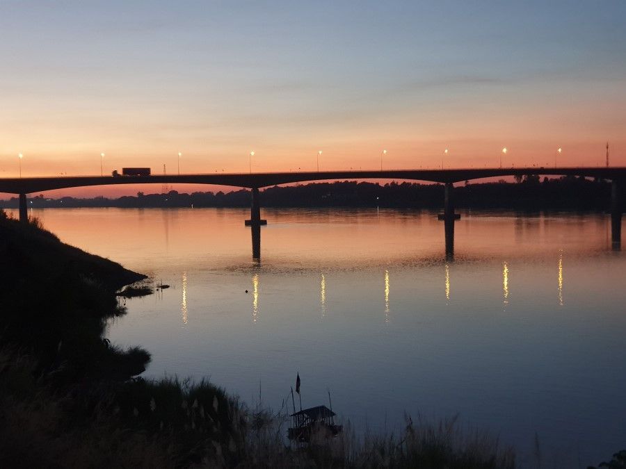 The bridge across the Mekong River at dusk. Laos is on the far side and Thailand is on the near side. (SPH Media)