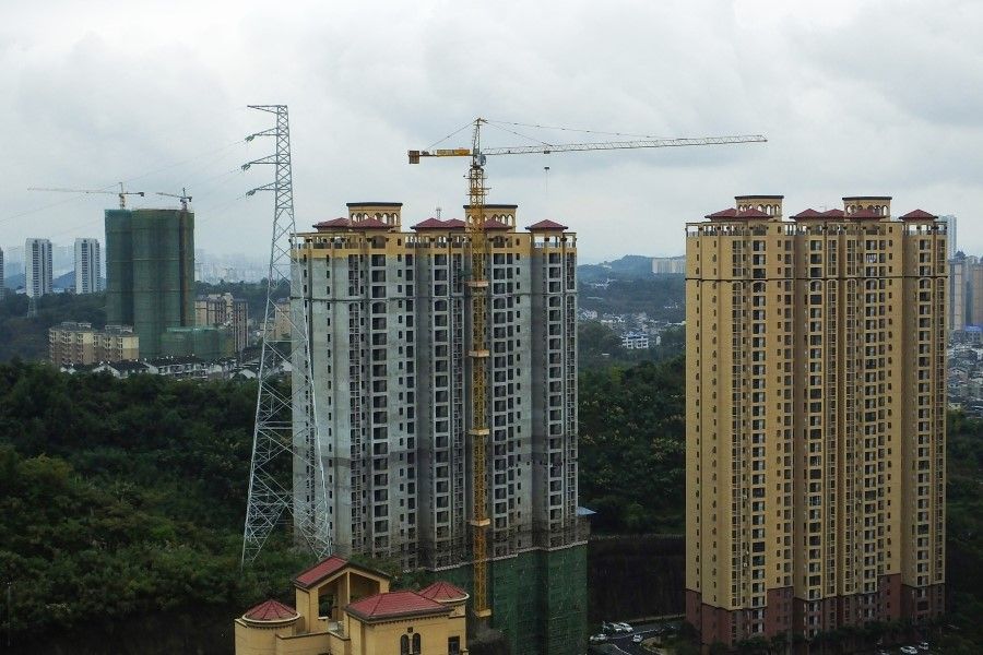 Residential buildings under construction are seen in Yichang in China's central Hubei province on 20 October 2021. (AFP)