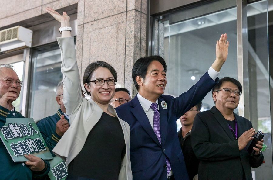 William Lai Ching-te (right), Taiwan's vice-president and presidential candidate for the ruling Democratic Progressive Party, and his running mate Hsiao Bi-khim, Taiwan's former representative to the US, pose for photographs after registering their candidacy at the Central Election Commission office in Taipei, Taiwan, on 21 November 2023. (I-Hwa Cheng/Bloomberg)