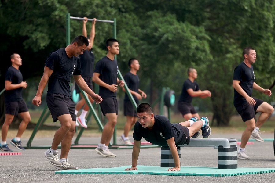 Soldiers participate in a physical training camp at the Army Infantry Training Command in Fengshan, Kaohsiung, Taiwan, 6 January 2022. (Ann Wang/Reuters)