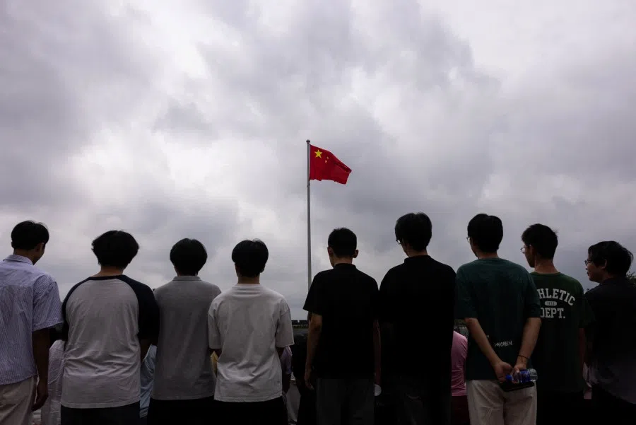 Young people pose for a photograph in Beijing, China, on 19 August 2025.