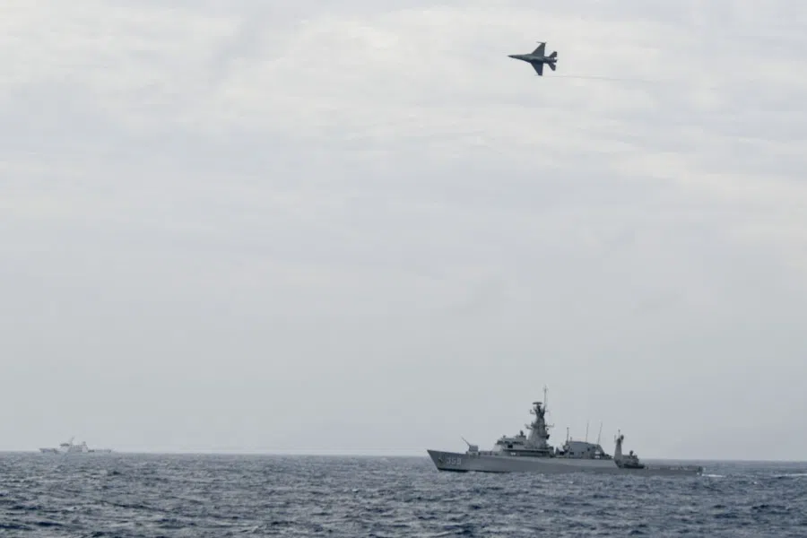 Indonesian Airforce's F-16 jet fighter flies over an Indonesian navy warship during an operation in Natuna, near the South China Sea, Indonesia, 10 January 2020. (Antara Foto/M Risyal Hidayat/via Reuters)