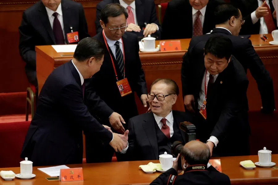 Chinese President Xi Jinping shakes hands with former Chinese President Jiang Zemin after the opening of the 19th National Congress of the Communist Party of China at the Great Hall of the People in Beijing, China, on 18 October 2017.