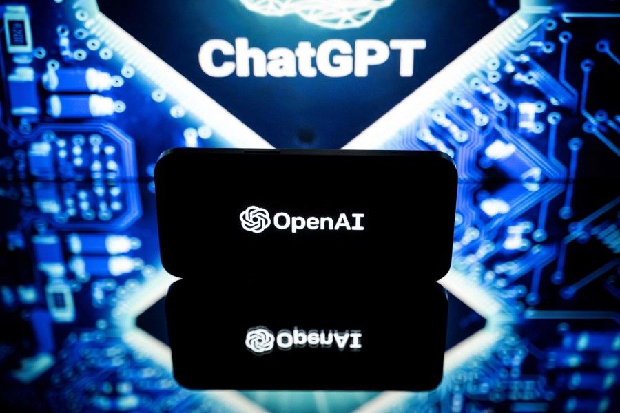 This file photo taken on 23 January 2023 in Toulouse, southwestern France, shows screens displaying the logos of OpenAI and ChatGPT. (Lionel Bonaventure/AFP)