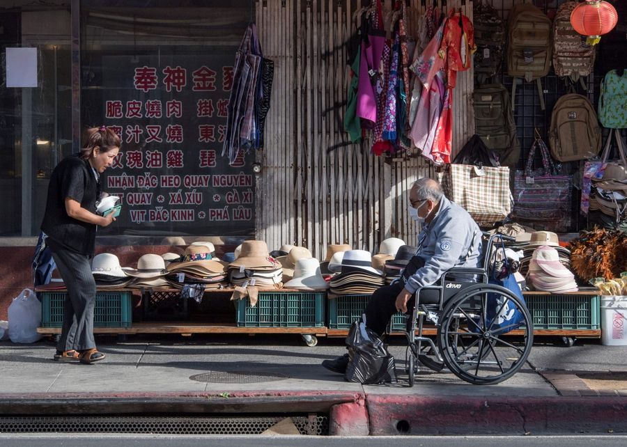 This file photo taken on 13 February 2020 shows shoppers at a deserted Los Angeles Chinatown as most stay away due to fear of the novel coronavirus, Covid-19. Chinatowns in Western countries have fallen quiet and businesses are struggling to survive as fears over the deadly novel coronavirus outbreak ripple around the world. (Mark Ralston/AFP)