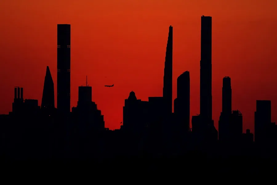 The New York City skyline is seen at sunset on 6 September 2023 in the Flushing neighborhood of the Queens borough of New York City. (Al Bello/AFP)
