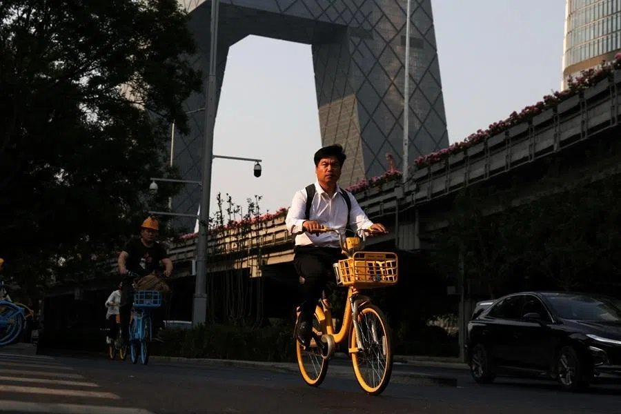 A man rides a shared bike at the central business district in Beijing, China, on 12 May 2026.