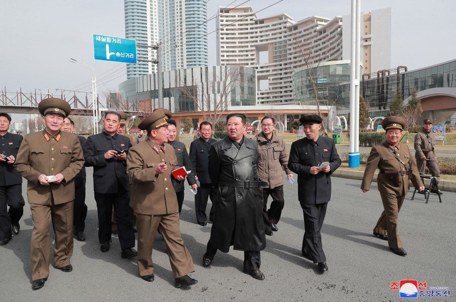 North Korean leader Kim Jong Un inspects the construction site for 10,000 households in the Songsin and Songhwa areas nearing completion, in North Korea, in this undated photo released on 16 March 2022 by North Korea's Korean Central News Agency (KCNA). (KCNA via Reuters)