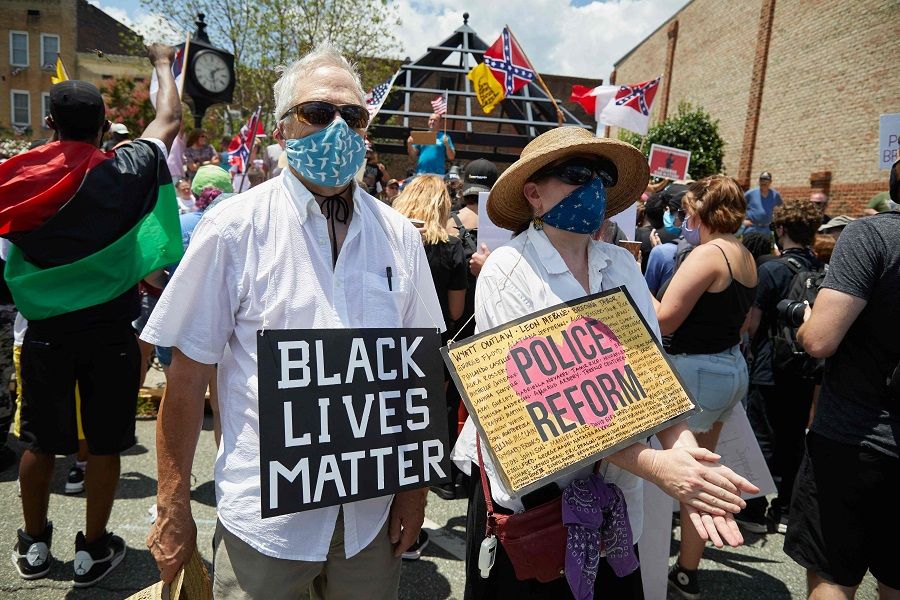 Anti-racism protesters with the Burlington-Alamance March For Justice and Community march in Graham, North Carolina, on 11 July 2020. (Logan Cyrus/AFP)