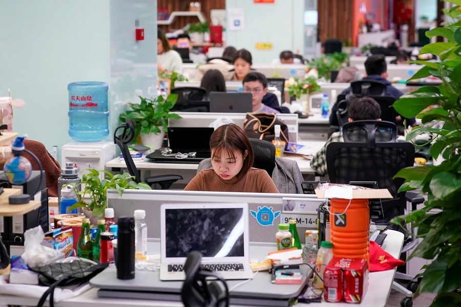 Employees work at an office at the headquarters of Ant Group, an affiliate of Alibaba, in Hangzhou, Zhejiang province, China, 29 October 2020. (Aly Song/Reuters)