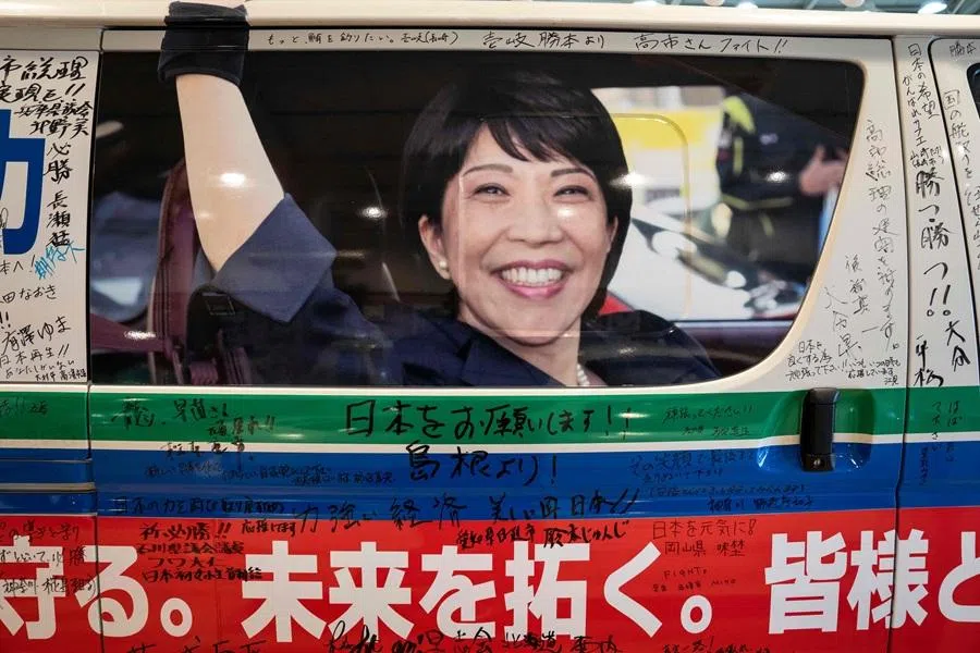 A Toyota HiAce used in the 2024 Liberal Democratic Party leadership race, featuring a photo of Japan's Prime Minister Sanae Takaichi and messages from supporters across Japan, is displayed at a museum in Nara on 14 January 2026.