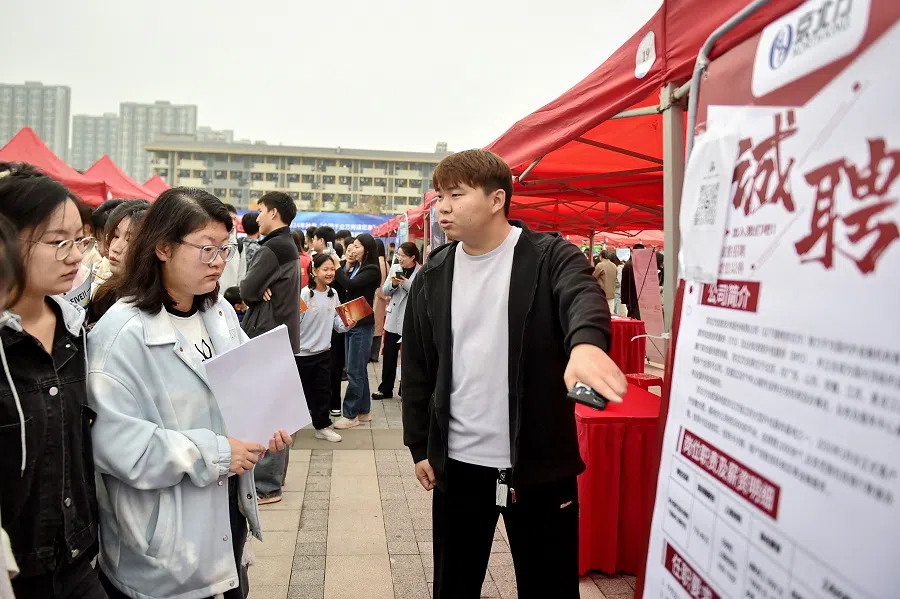 This photo taken on 16 November 2024 shows students attending a job fair in Hefei, in eastern China’s Anhui province. (AFP)