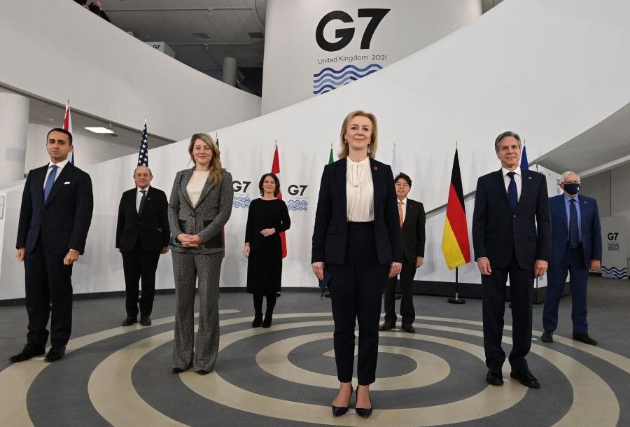 In this file photo taken on 11 December 2021, G7 foreign ministers pose for a group photograph ahead of bilateral talks at the G7 Foreign and Development Ministers meeting in Liverpool, northwest England. (Paul Ellis/AFP)