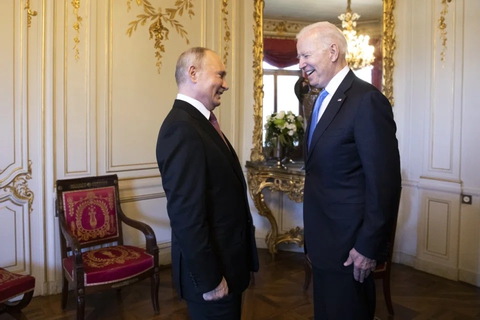 Vladimir Putin, Russia's president, left, and U.S. President Joe Biden, right, react at the start of the U.S. Russia summit at Villa La Grange in Geneva, Switzerland, on 16 June 2021. (Peter Klaunzer/Swiss Federal Office of Foreign Affairs/Bloomberg)