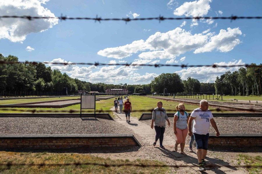 People visiting the museum in former Nazi Death Camp Stutthof, in Sztutowo, 21 July 2020. (Wojtek Radwanski/AFP)