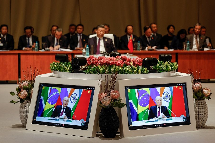 Chinese President Xi Jinping attends the plenary session as Russian President Vladimir Putin delivers his remarks virtually during the 2023 BRICS Summit in Johannesburg, South Africa, on 23 August 2023. (Gianluigi Guercia/Pool via Reuters)
