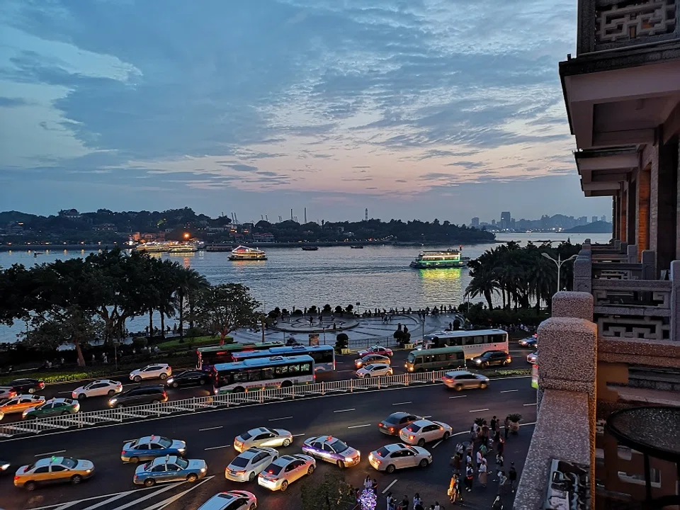 The balcony hangs over the street, and stepping out feels like being in the centre of the bustling road.