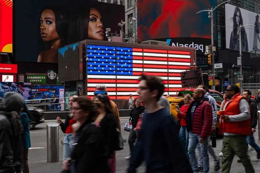 People walk through Times Square, New York City, US, on 28 March 2025. (Spencer Platt/Getty Images/AFP)