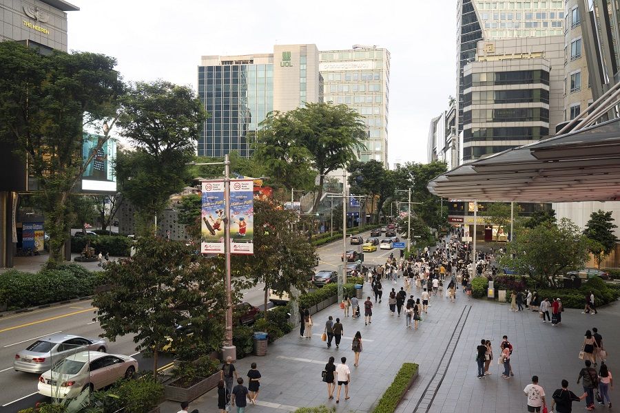 Shoppers on Orchard Road in Singapore on 22 January 2022. (Ore Huiying/Bloomberg)